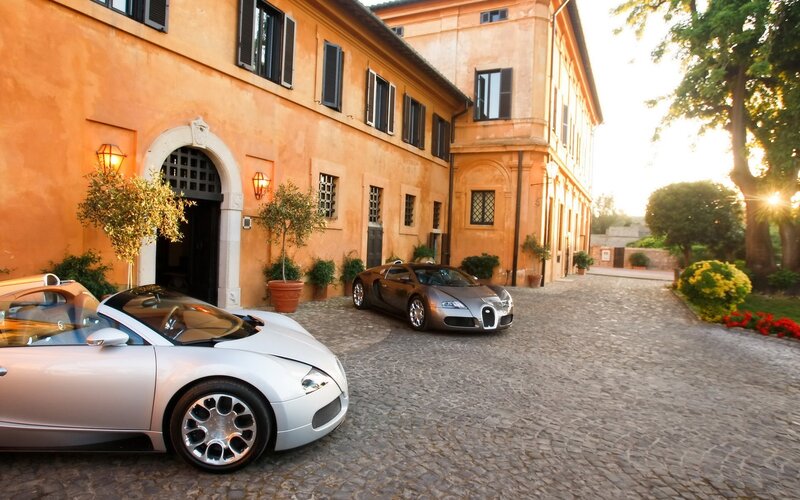 Bugatti cars in courtyard