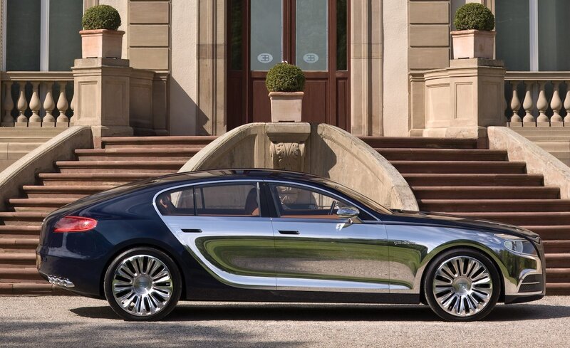 Bugatti luxury car in front of mansion