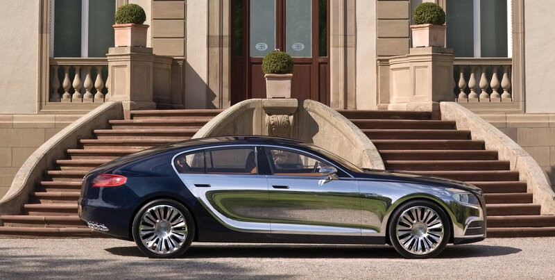 Bugatti luxury car in front of mansion