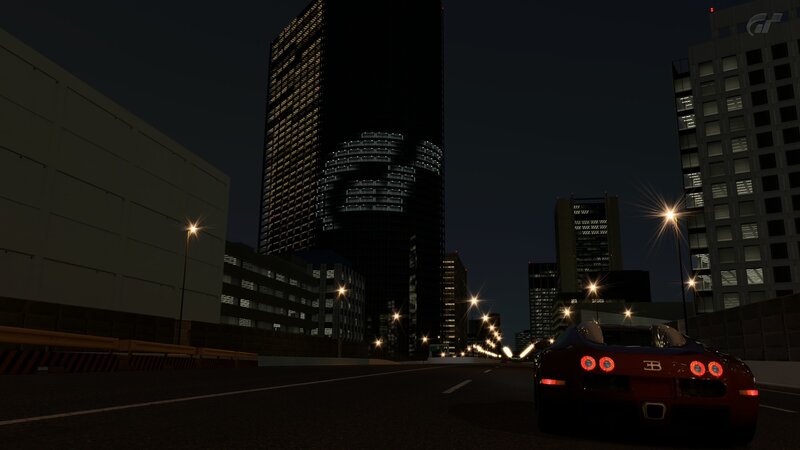 Bugatti on city street at night