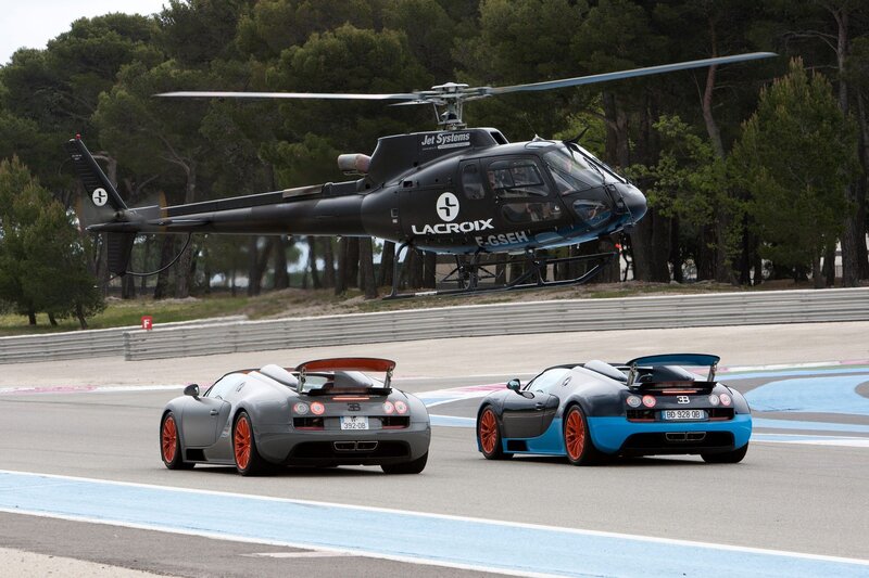 Bugatti Veyron and helicopter on track