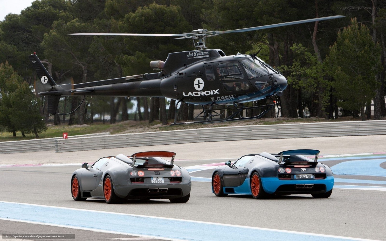 Bugatti Veyron and helicopter on track