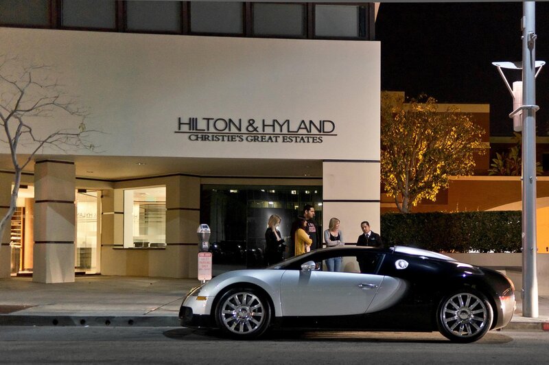 Bugatti Veyron outside real estate office