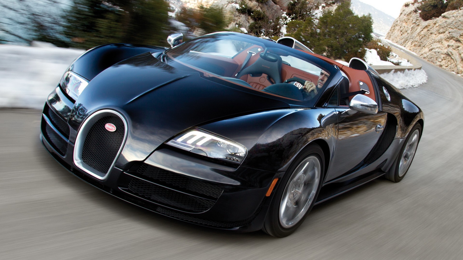 Bugatti Veyron speeding on mountain road