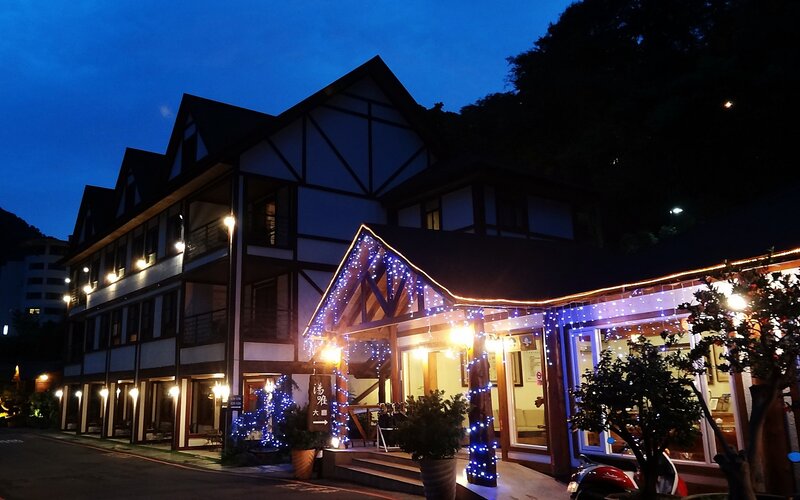 building at dusk with lights