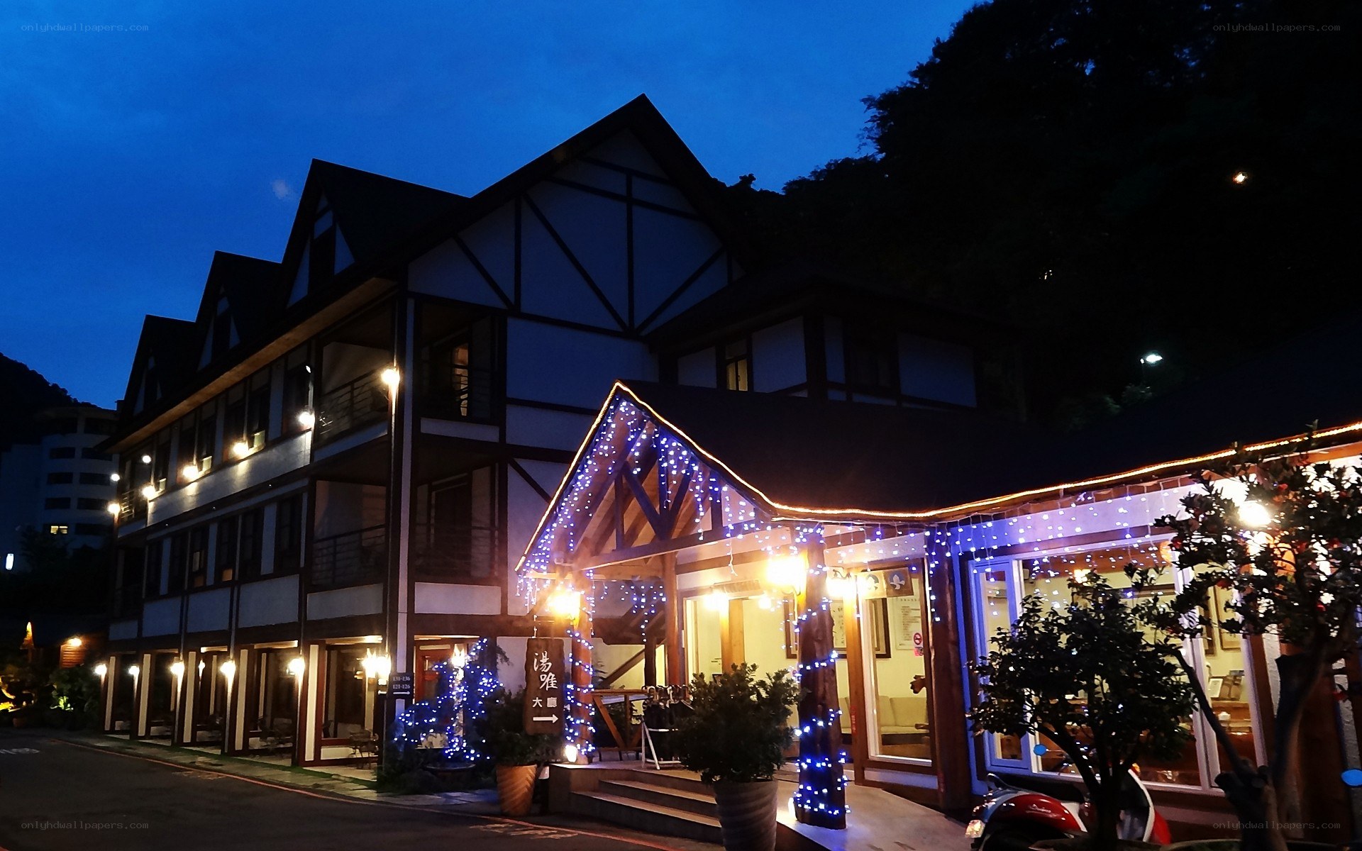 building at dusk with lights
