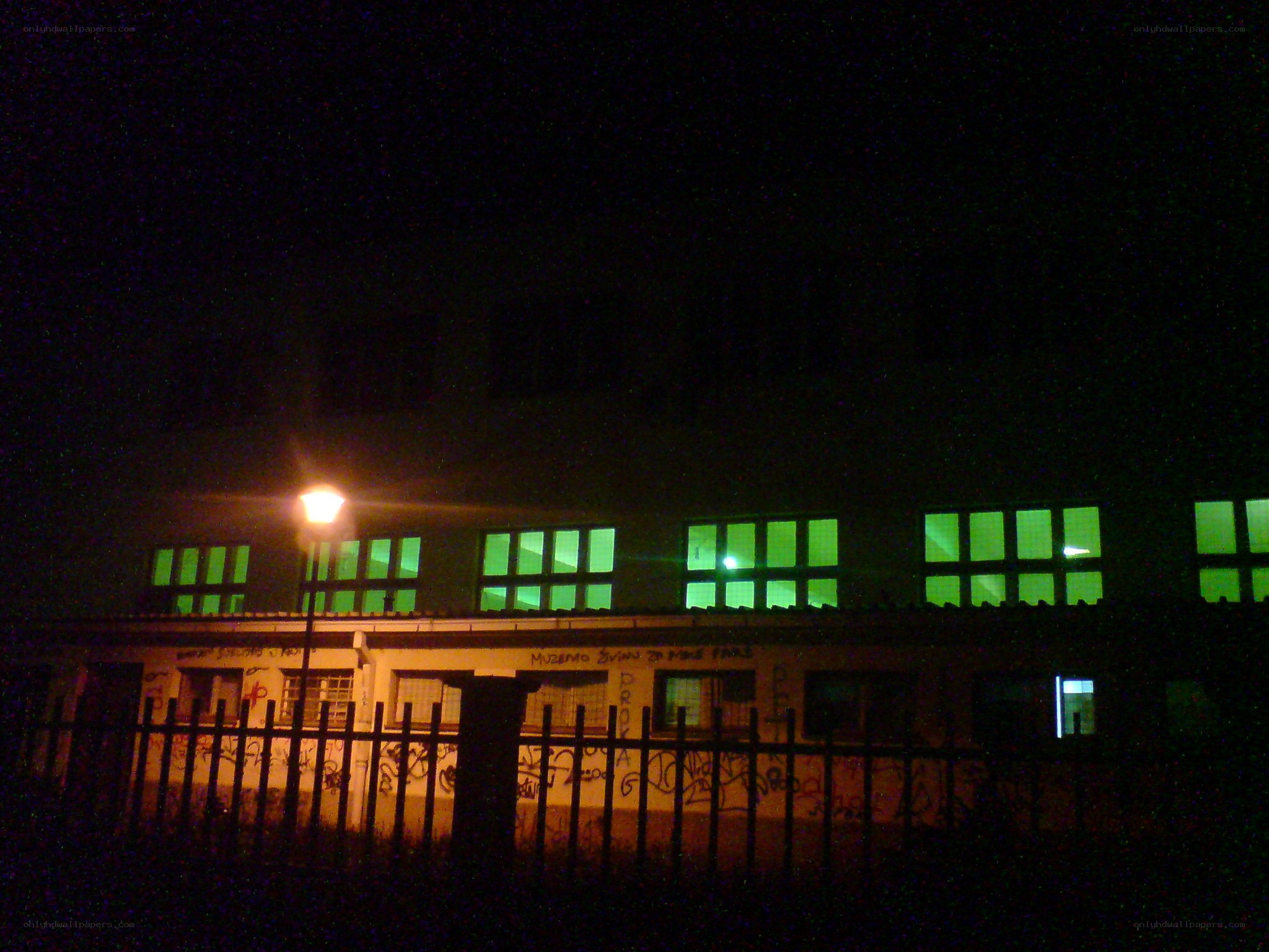 building at night with green lights