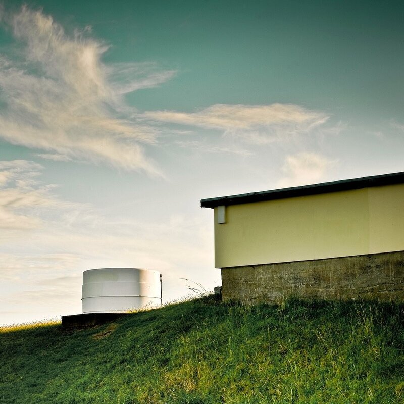 Building on a grassy hill