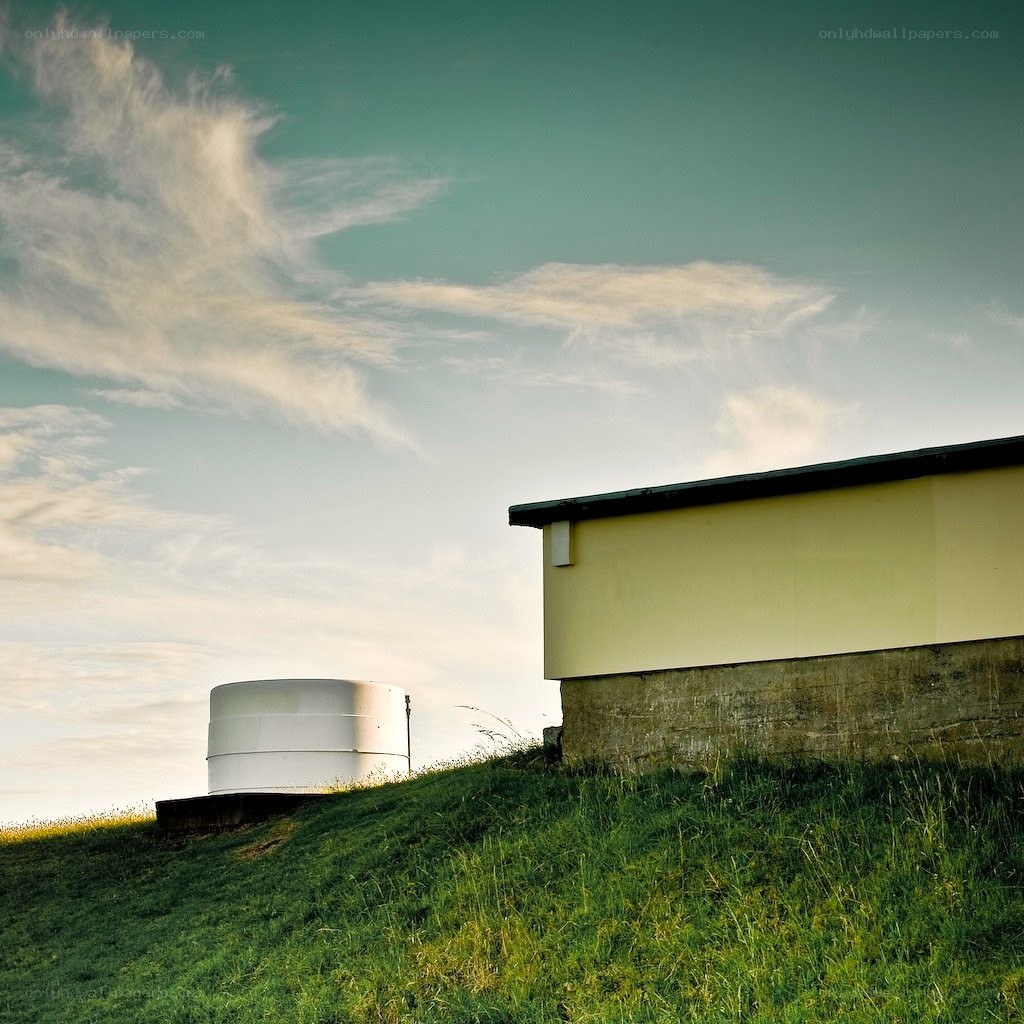 Building on a grassy hill