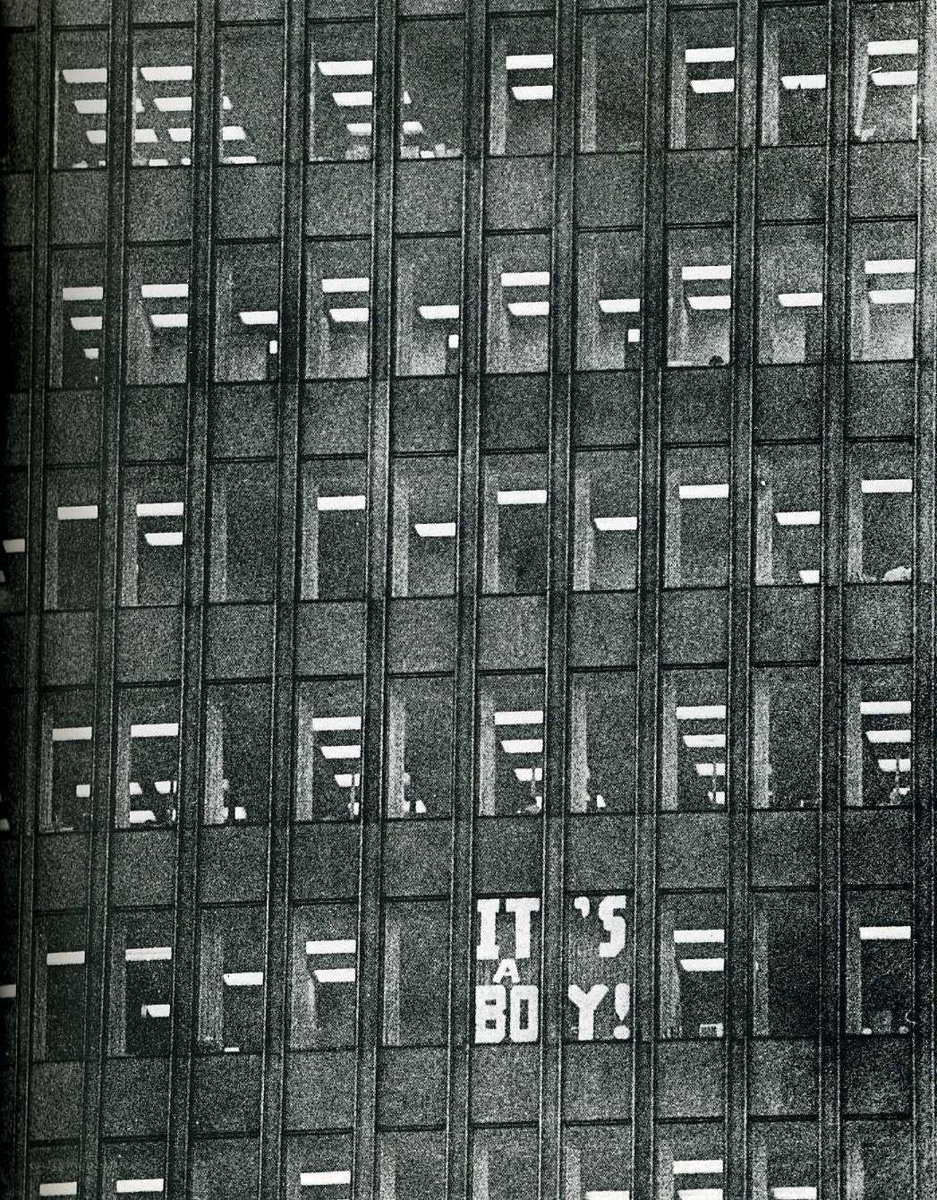 Building with 'It's a Boy!' sign