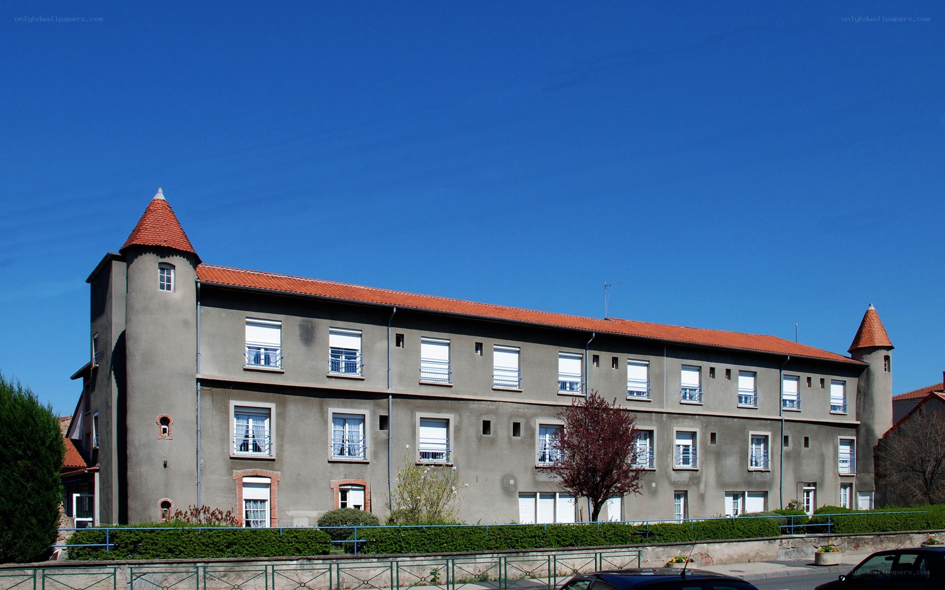 building with turrets under blue sky