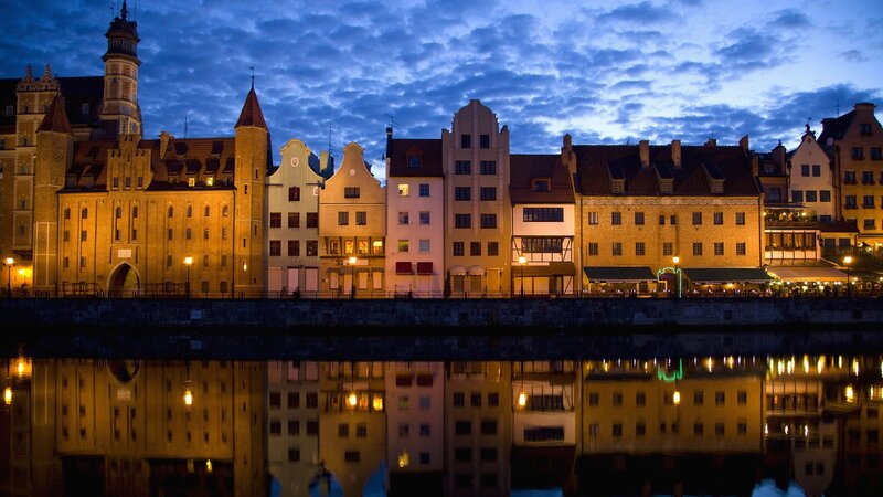 Buildings Along River at Dusk