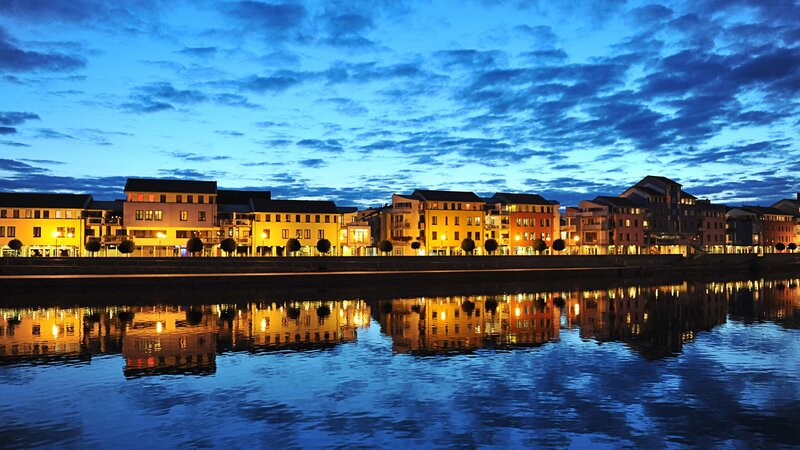 Buildings Along Riverbank — Blue, Serene, Night, Photograph, River, Sky, Lights