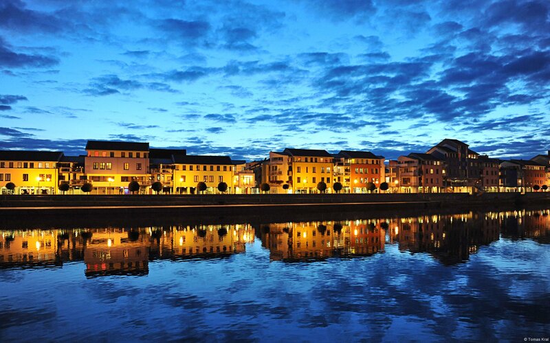 Buildings Along Riverbank — Blue, Serene, Night