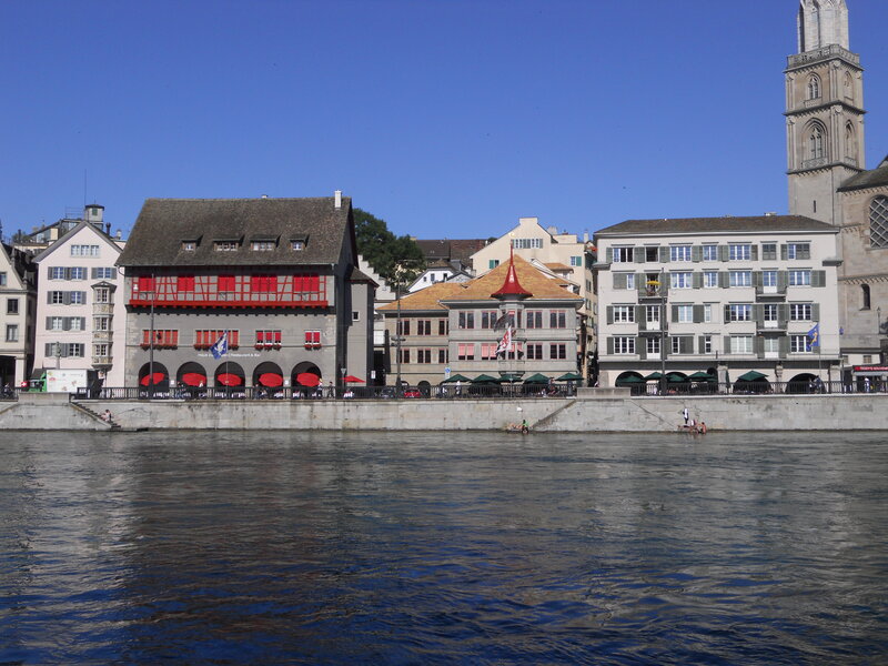 Buildings Along Riverbank — Blue, Serene