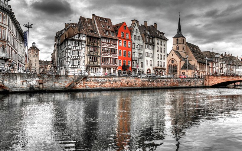 Buildings Along Riverbank — Gray, Dramatic