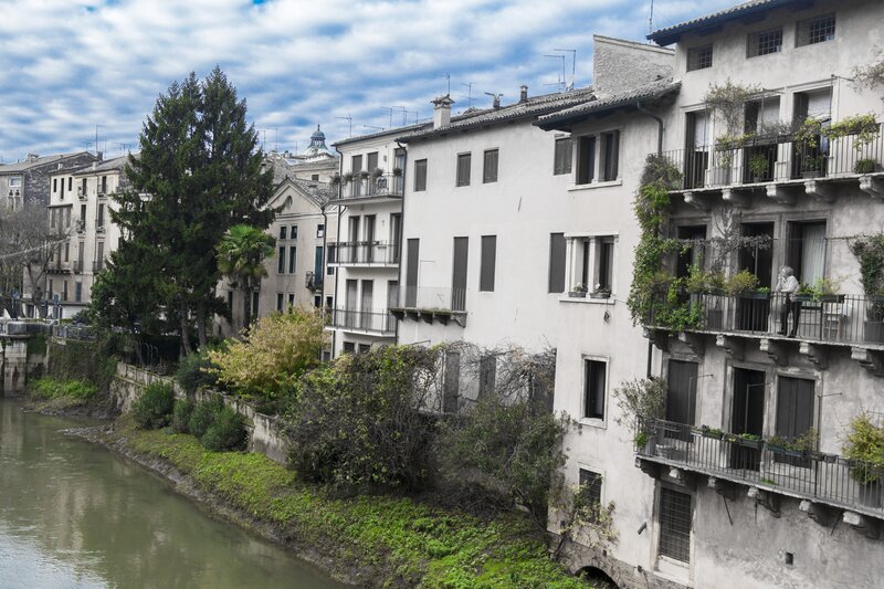 Buildings Along Riverbank — White