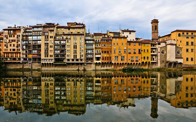 Buildings Along Riverbank — Yellow, Serene, Afternoon, Photograph
