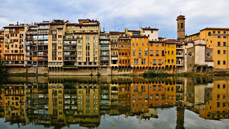 Buildings Along Riverbank — Yellow, Serene
