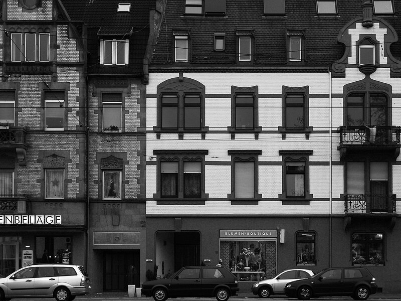 Buildings and Cars on Street — Black, Neutral, Photograph, Windows, Balconies