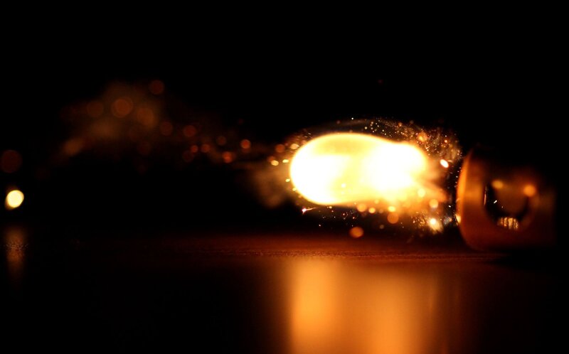 Bulb exploding in darkness