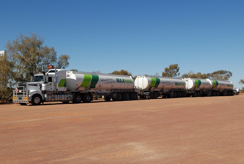 Bulk trans tanker trucks on dirt road