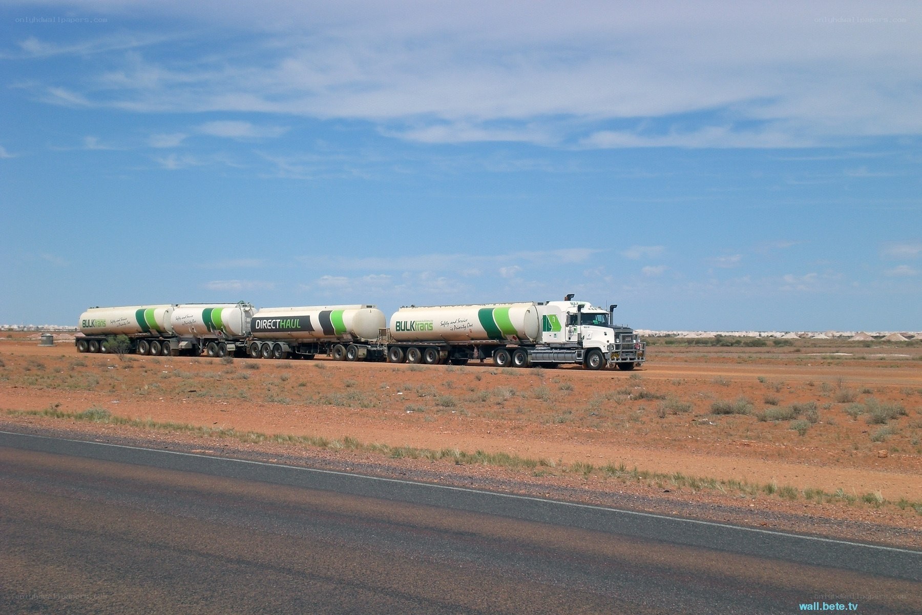 Bulk transport trucks in desert