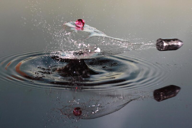 Bullet and gem drop in water