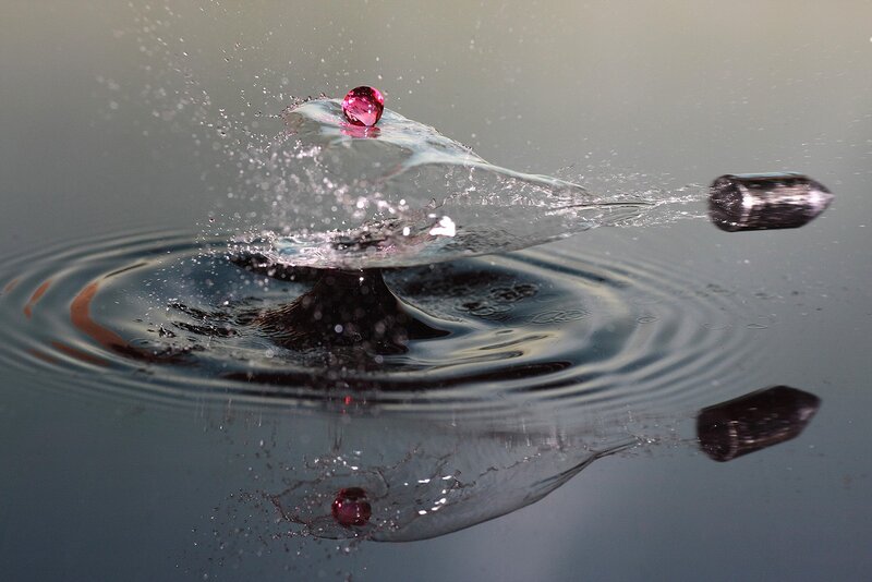 Bullet hitting water with gem