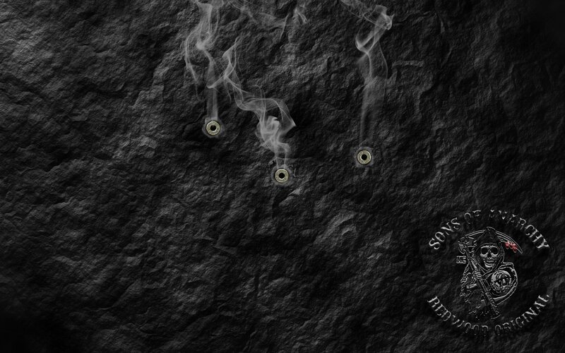 bullet holes with smoke on stone