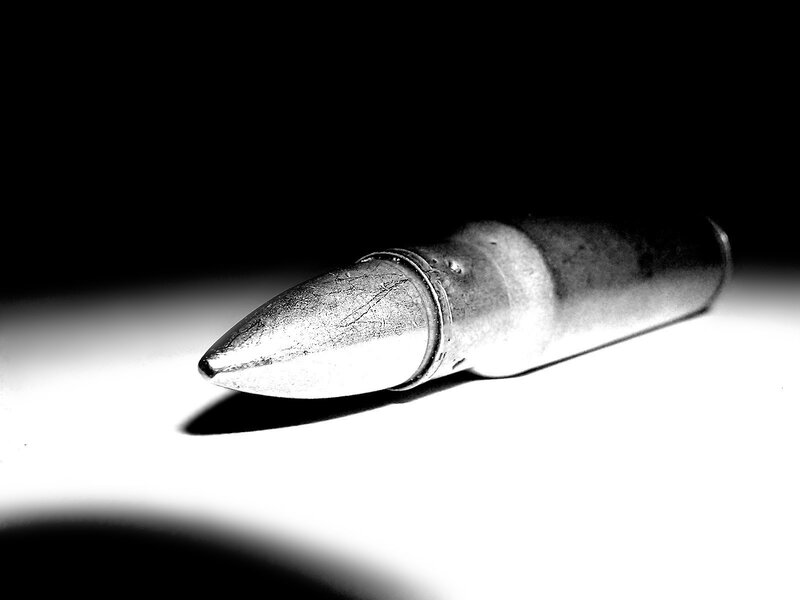 bullet on white surface