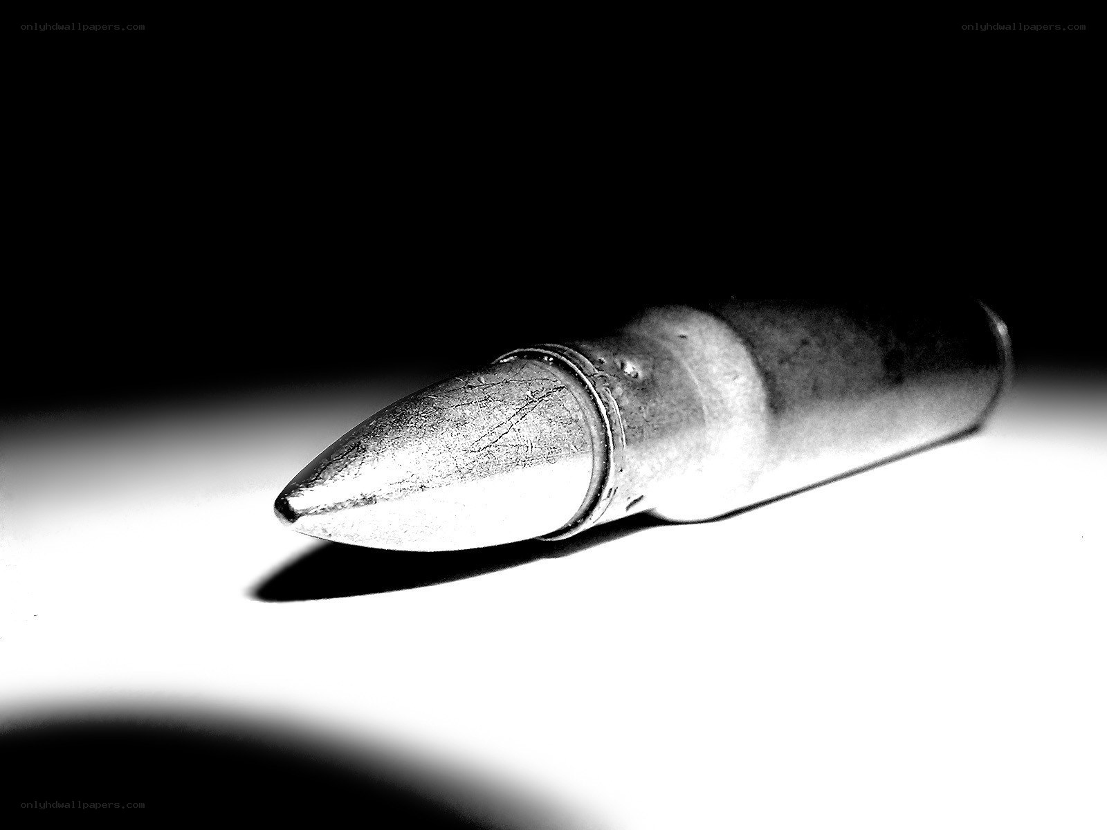 bullet on white surface