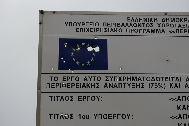 Bullet-riddled EU sign