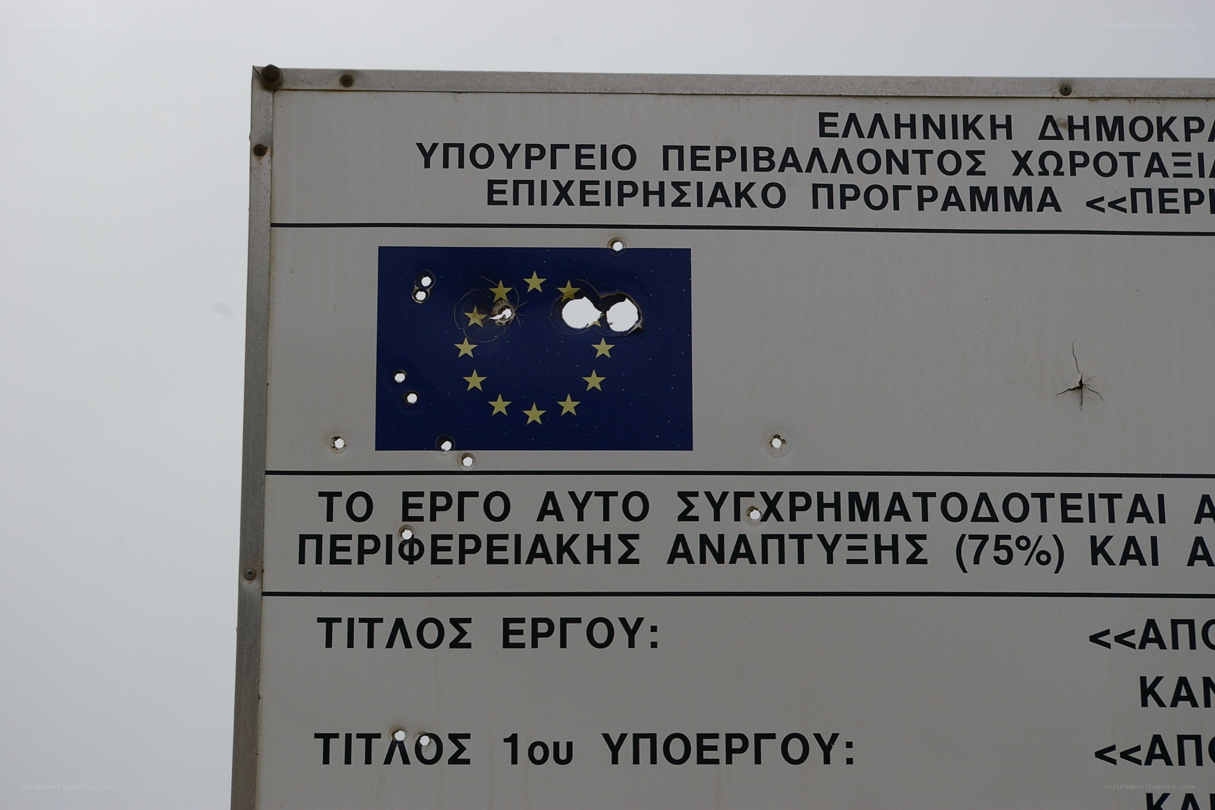 Bullet-riddled EU sign
