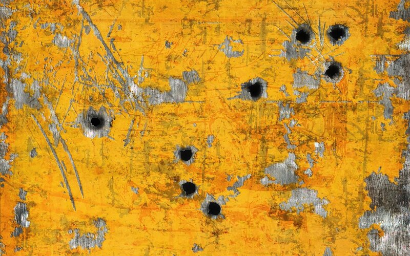 Bullet-riddled Metal Surface