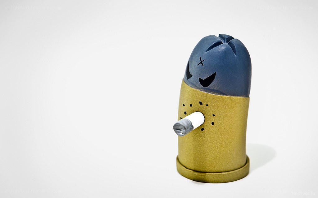 bullet-shaped figurine with cigarette