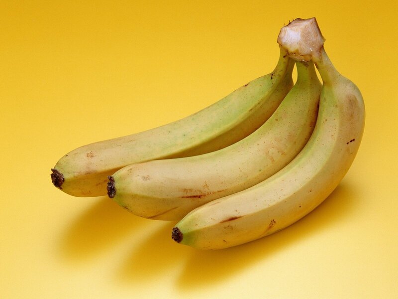 bunch of bananas on yellow