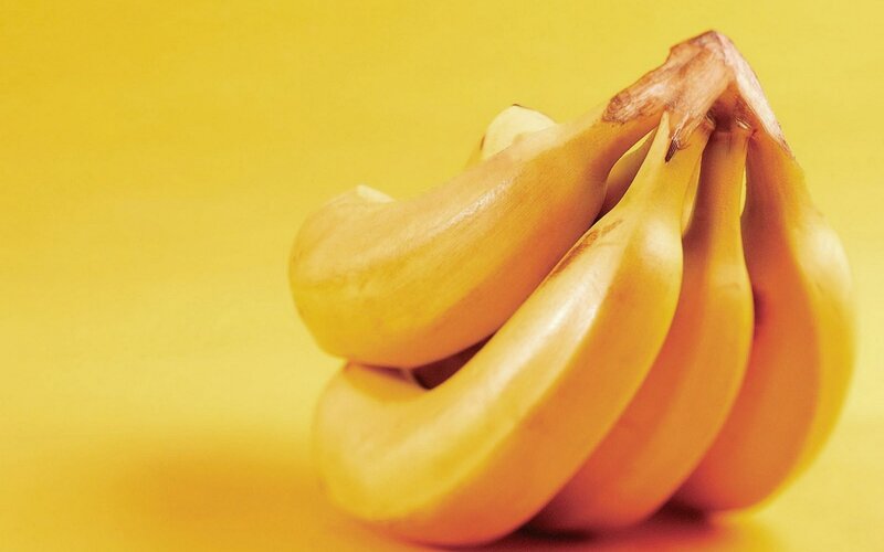 bunch of bananas on yellow