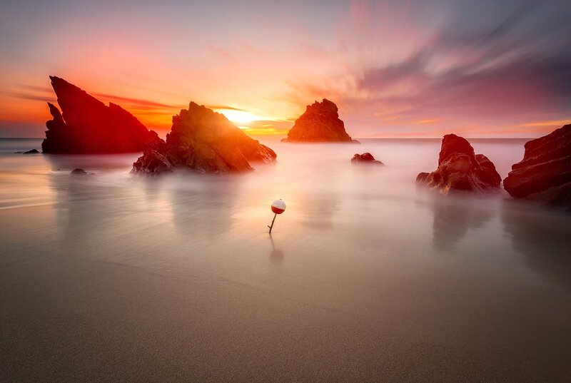 Buoy on Beach at Sunset