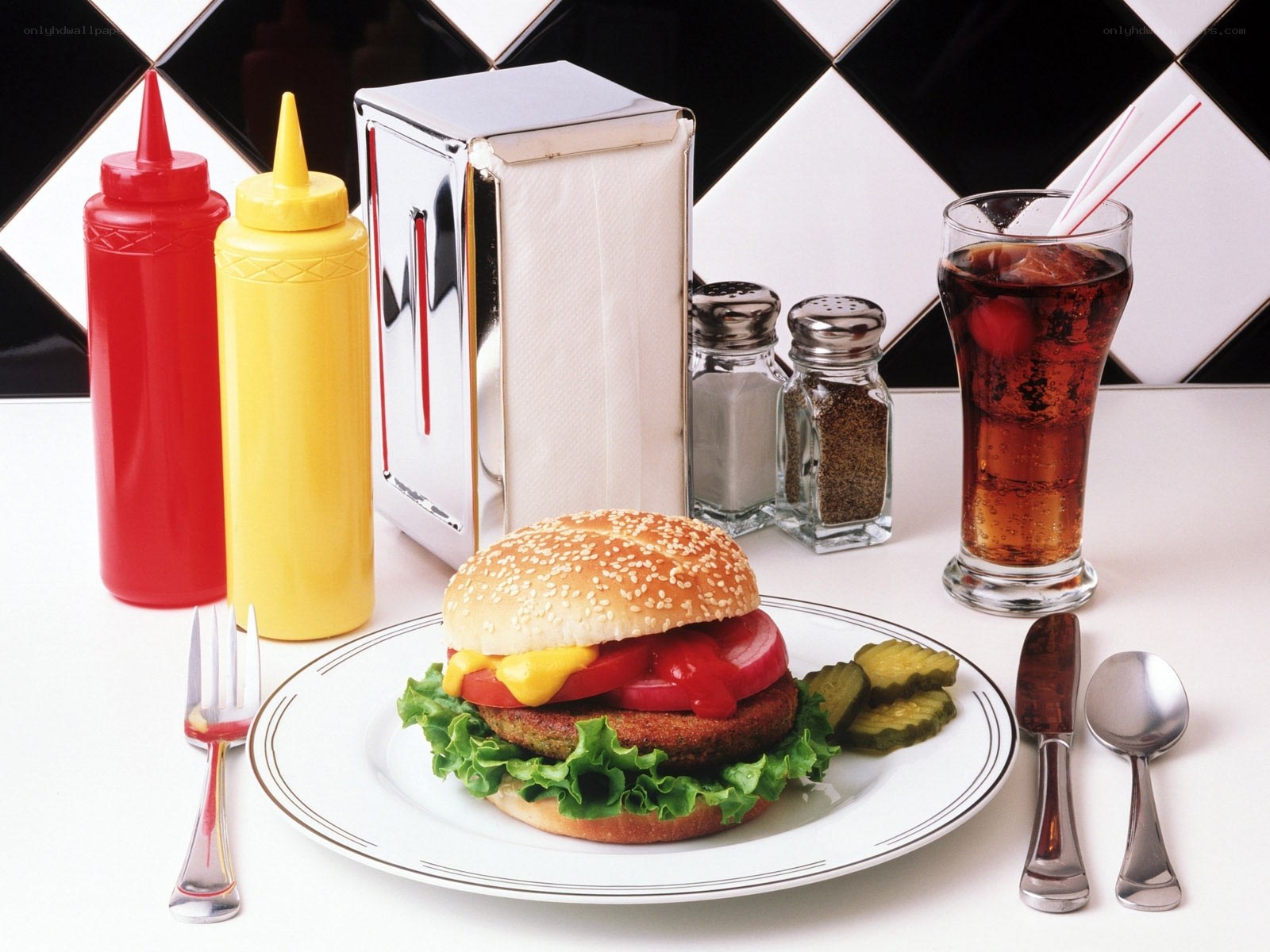 Burger and soda on table
