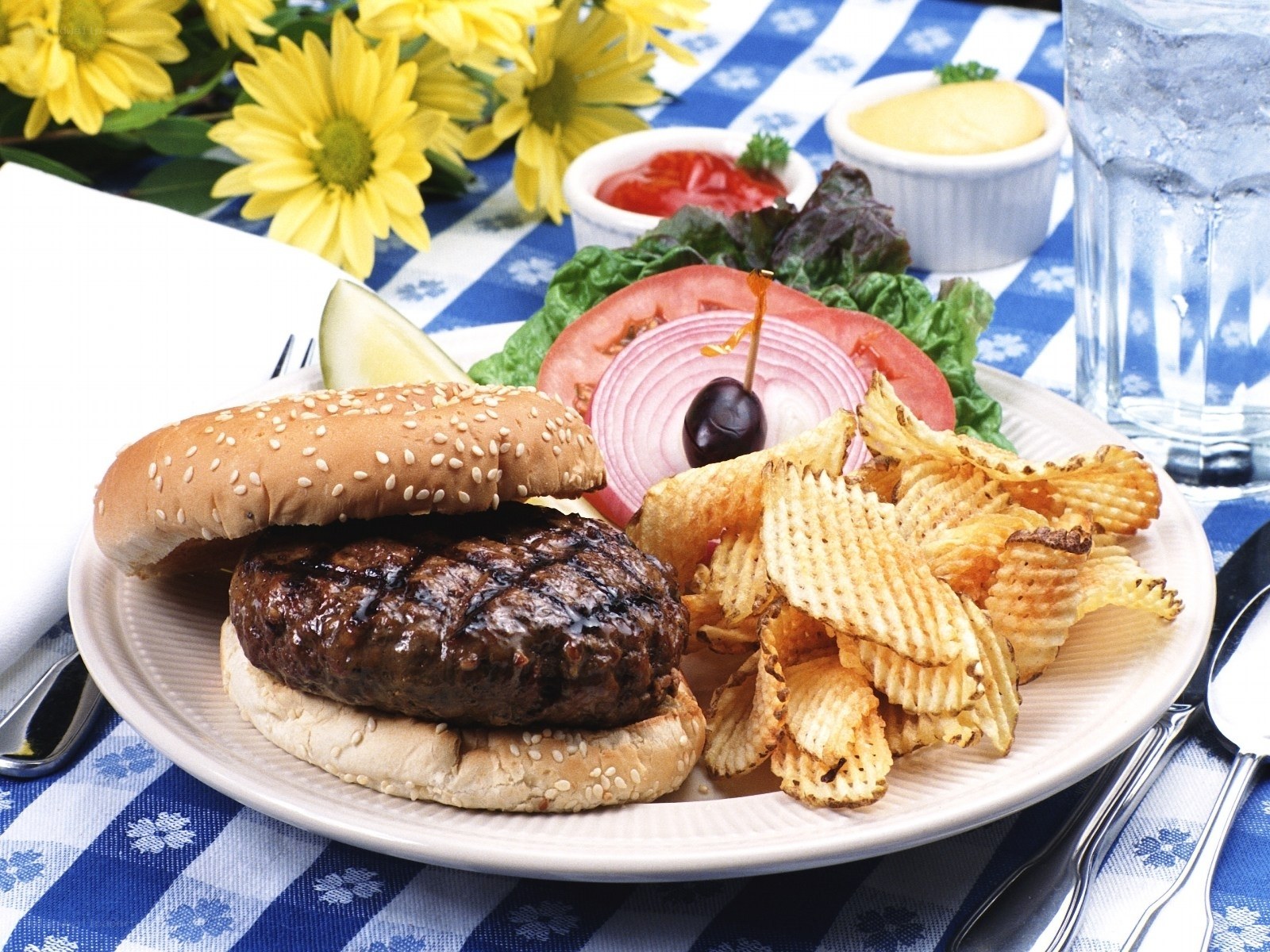 Burger with chips and flowers