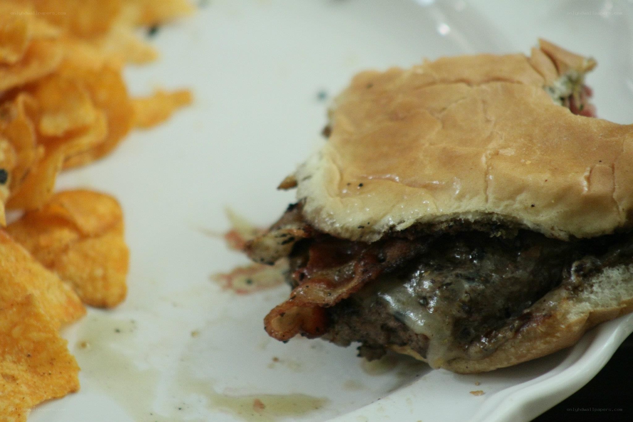 burger with chips on a plate