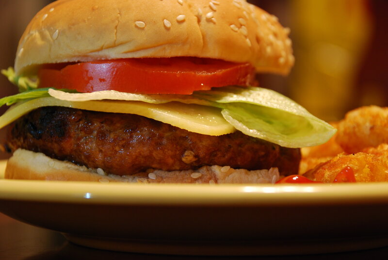 Burger with fries on plate