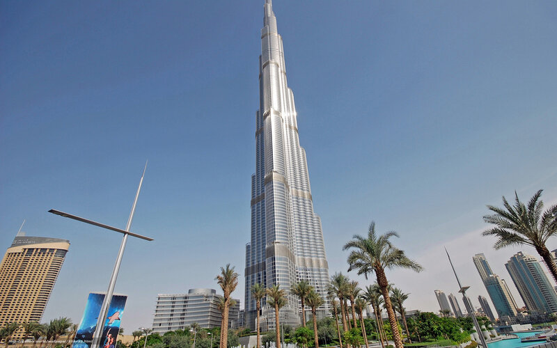 Burj Khalifa Skyscraper — Blue, Dramatic, Afternoon, Photograph, Palm Trees