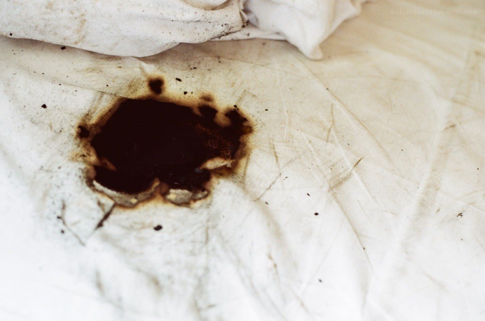 burned fabric with hole