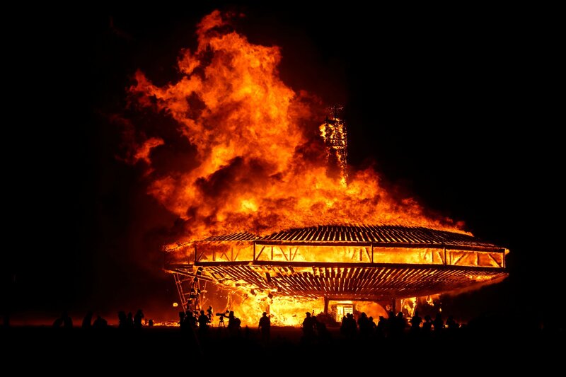 Burning art installation at night