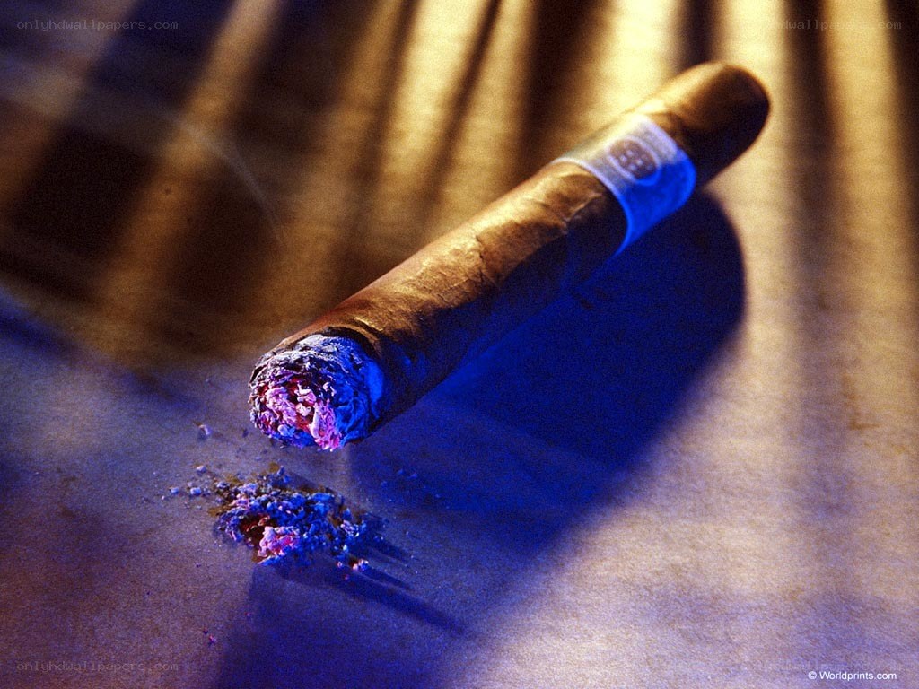 burning cigar on surface
