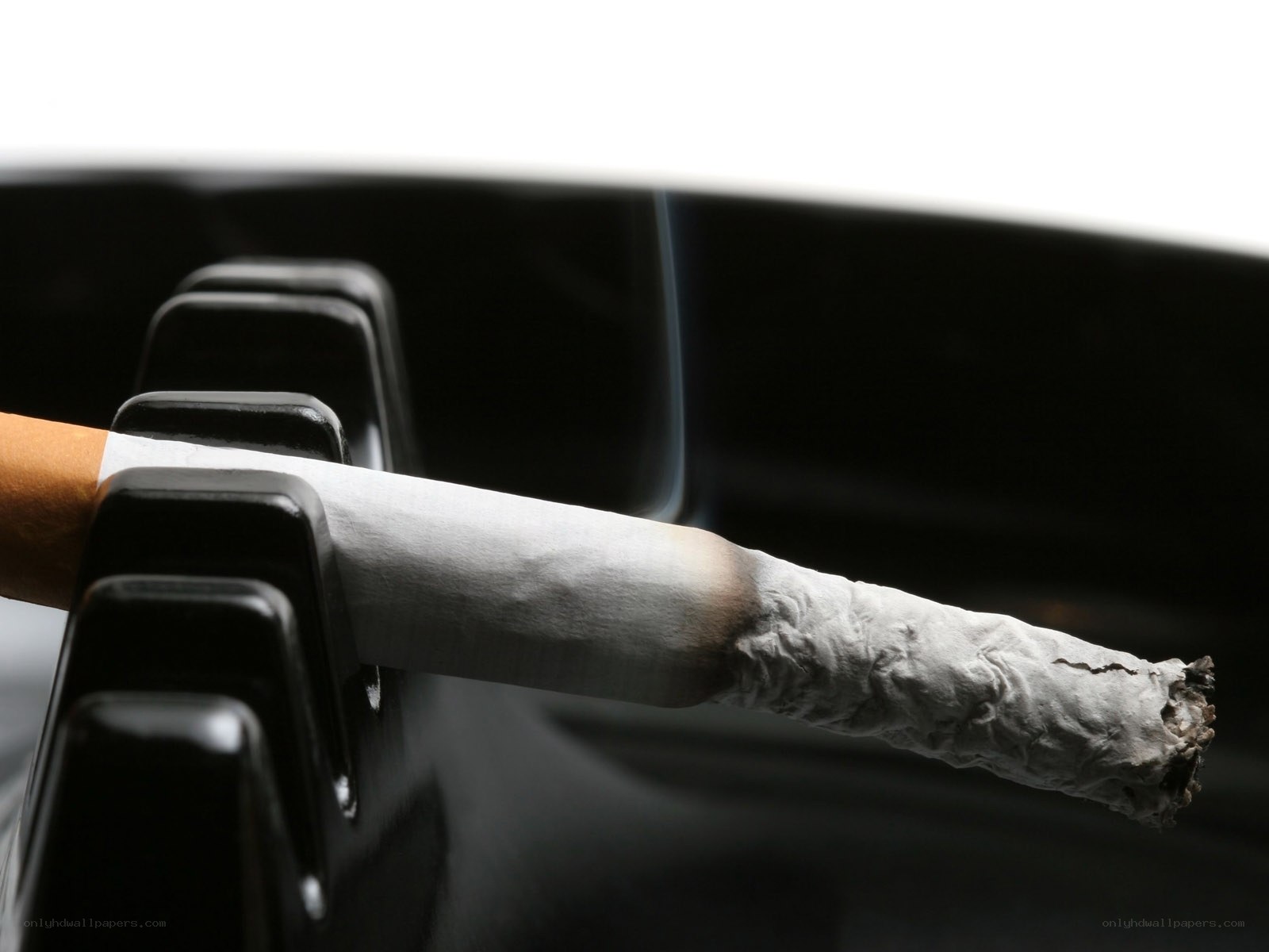 burning cigarette in ashtray