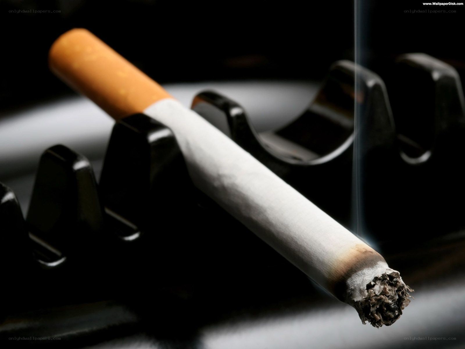 burning cigarette in ashtray