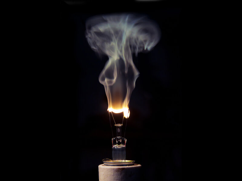 Burning Light Bulb — Black